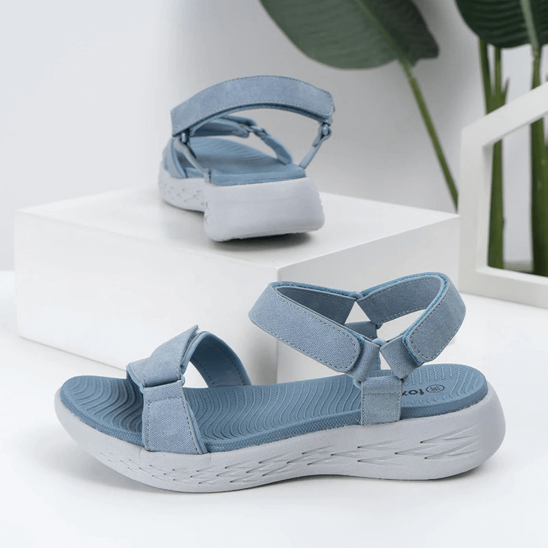 Blue soft sole wedge sandals for women with open design and hook & loop closure, perfect for sports and active lifestyles.